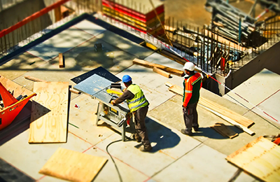 aerial view of a construction site with two workers